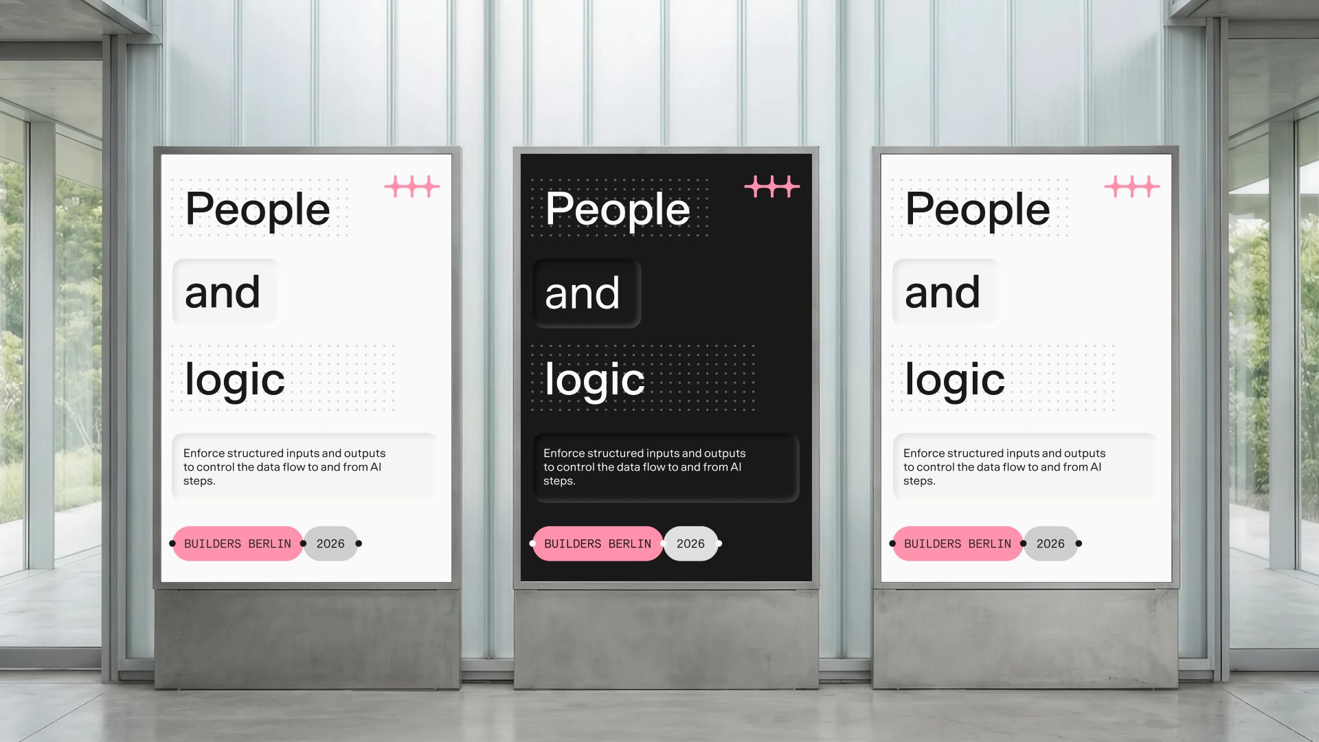 Three “People and logic” posters in a lobby, one each in Light, Dark, and Maker mode