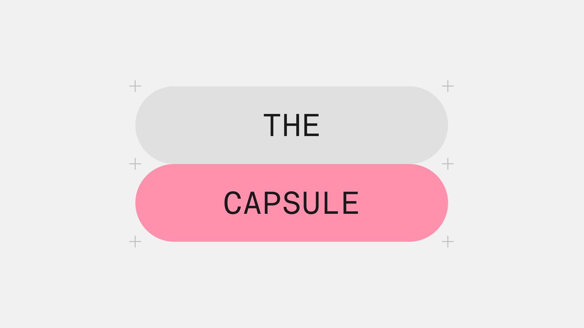 Two stacked capsules reading “The” and “Capsule”