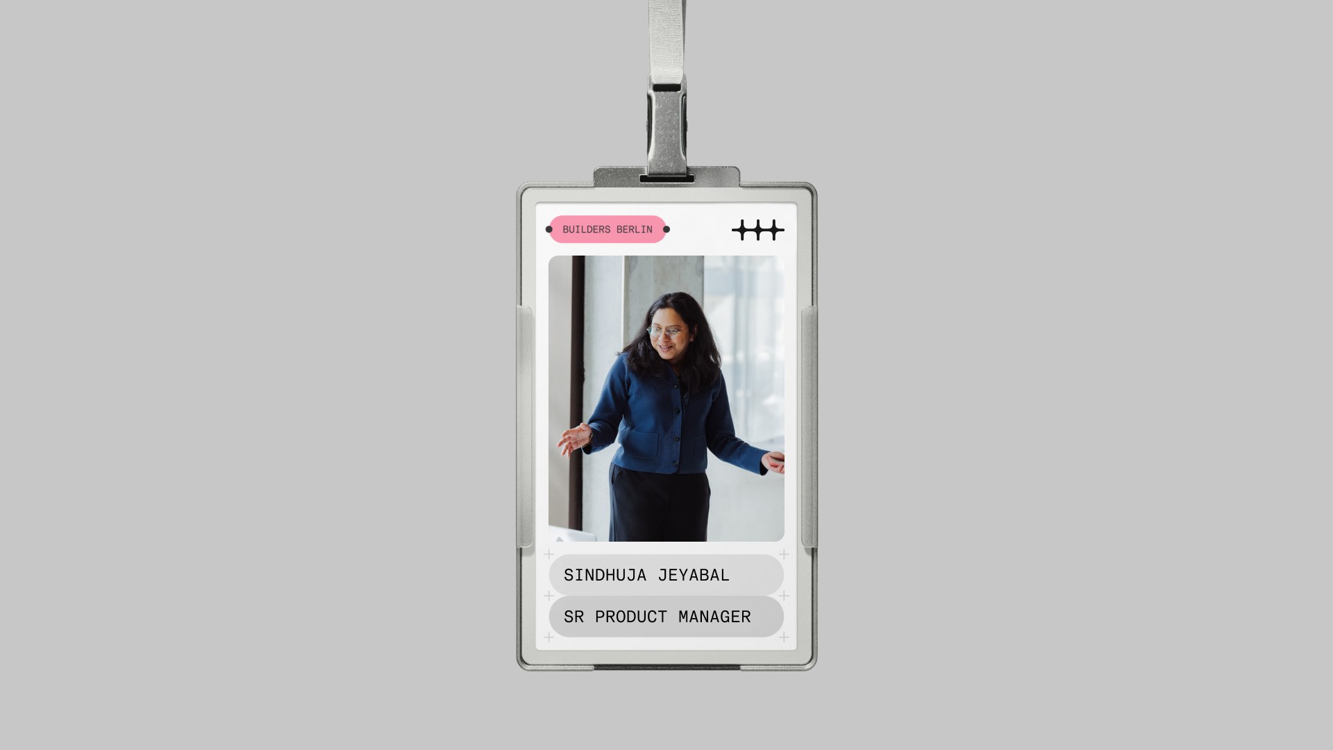 Builders Berlin event badge on a lanyard, with the n8n symbol, a speaker photo, and name pills